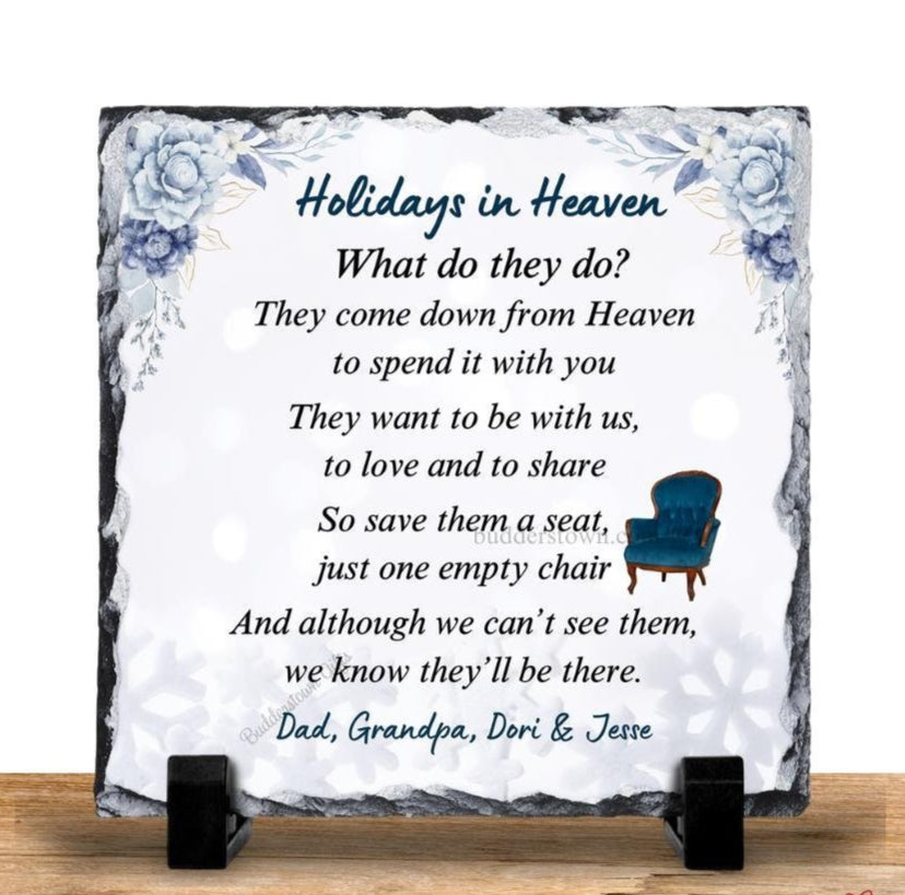 A blue Christmas slate plaque with white text and a blue ribbon design, including a chiseled edge and display feet.