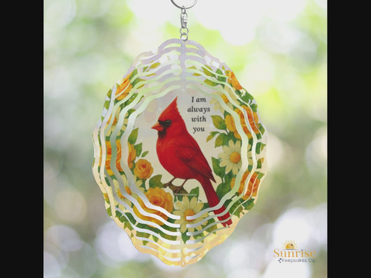 Video Cardinal memorial wind spinner featuring a red cardinal, yellow roses, and daisies with the phrase "I am always with you" on a soft blue sky background.