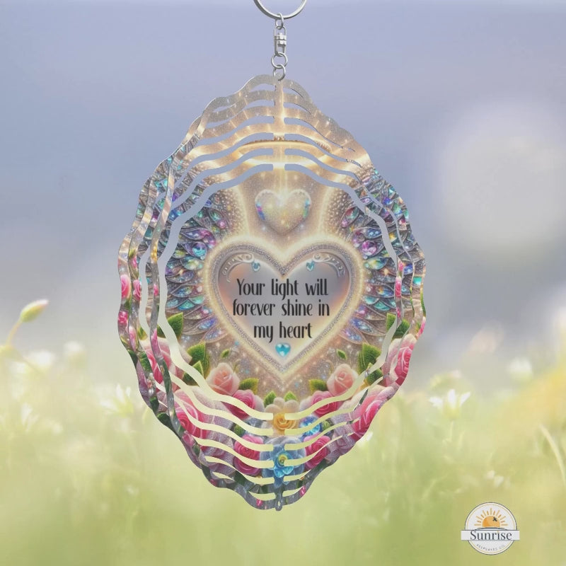 Memorial Wind Spinner with photo.  Angel wings and flowers with a heart in the middle.  One side the heart is a photo the other side wording, your light will shine forever in my heart - 10 inches - beautiful memorial or sympathy gift for grief