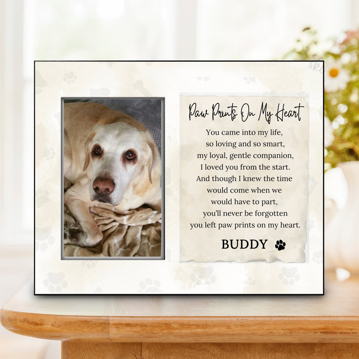 Framed picture of a dog with a heartwarming message on a white surface.