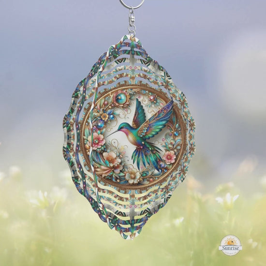 Turquoise hummingbird wind spinner with gold accents and intricate floral details. A stunning outdoor decor piece and meaningful gift for nature lovers or remembrance.
