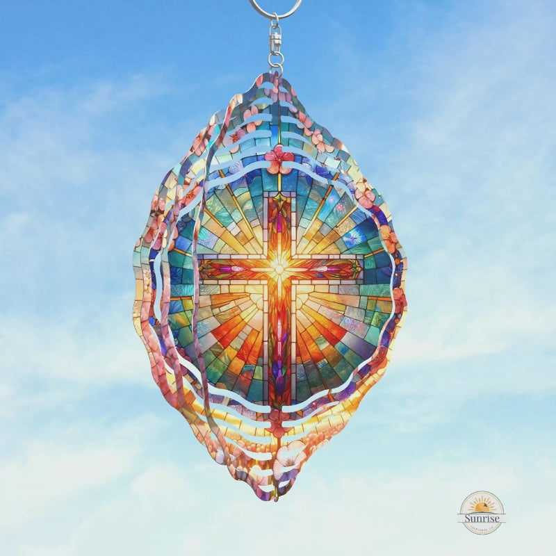 Stained glass-style cross wind spinner with vibrant colors and a radiant glow. A beautiful religious gift and memorial tribute for faith and remembrance.