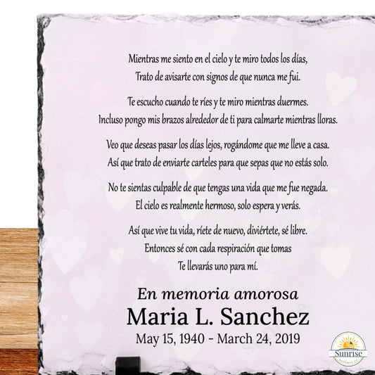 Close up of memorial slate featuring a Spanish remembrance poem in black text and the names 'Maria L. Sanchez' with dates below.